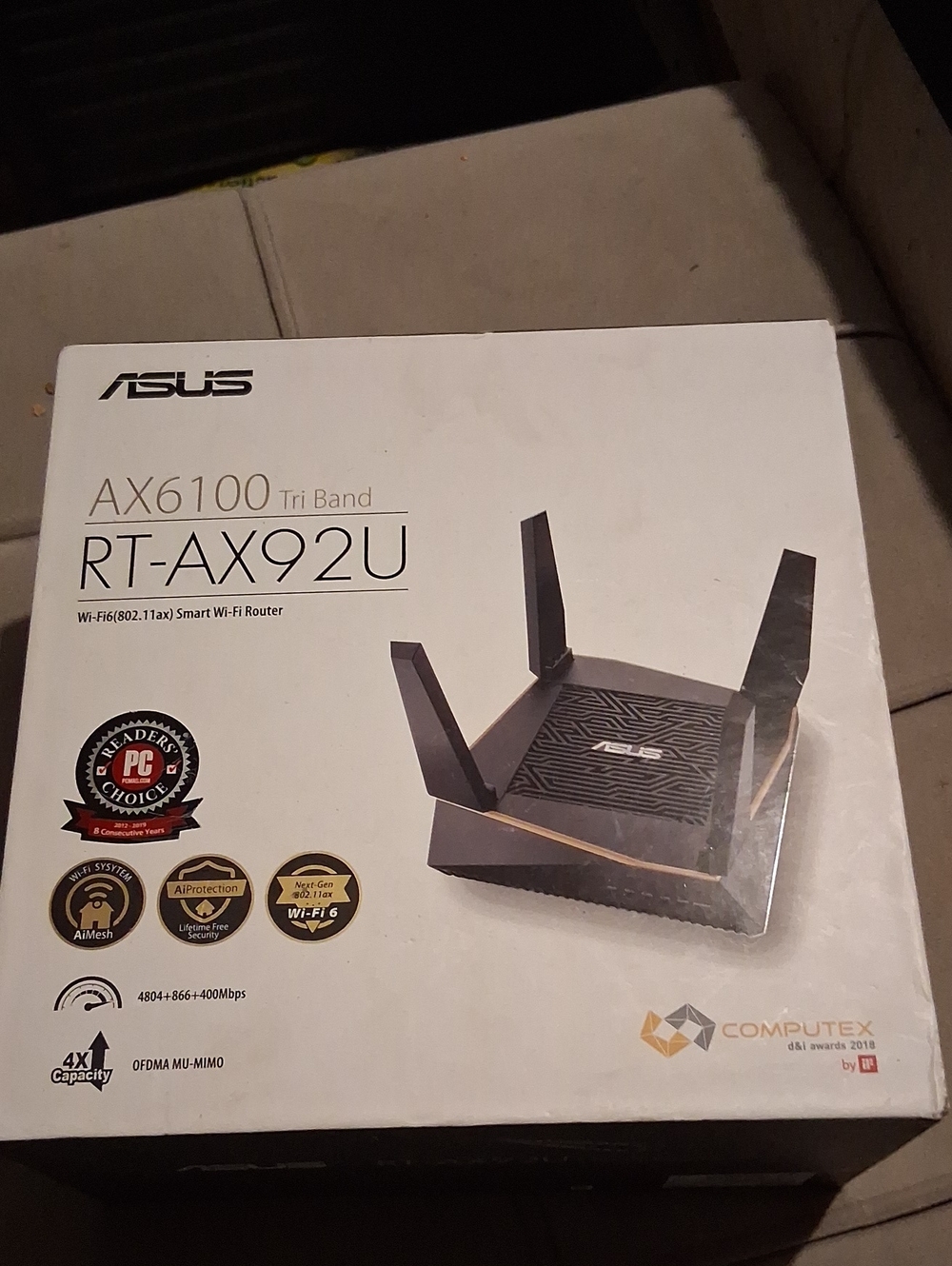 ASUS RT-AX92U Tri-Band Router in black with gold accents